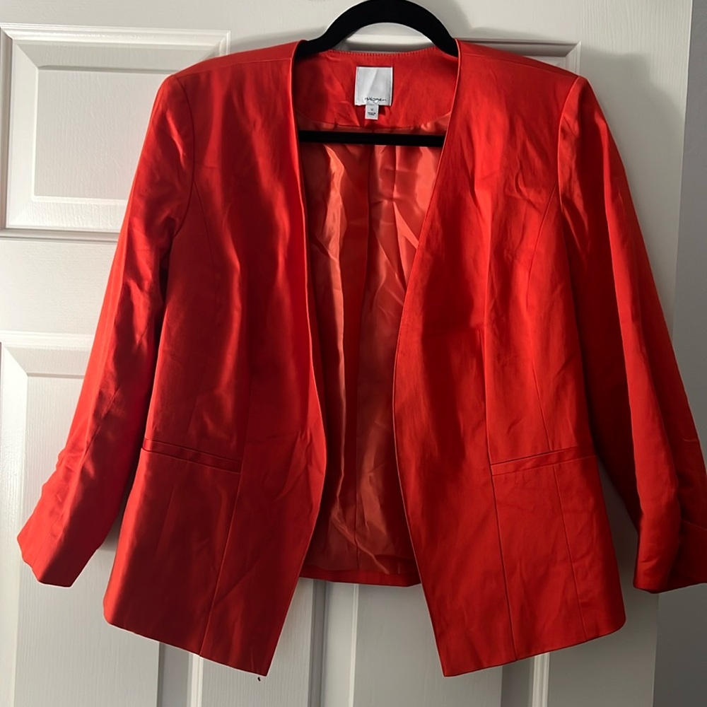 Gorgeous halogen, orange blazer. Very flattering cut. Super cute with jeans